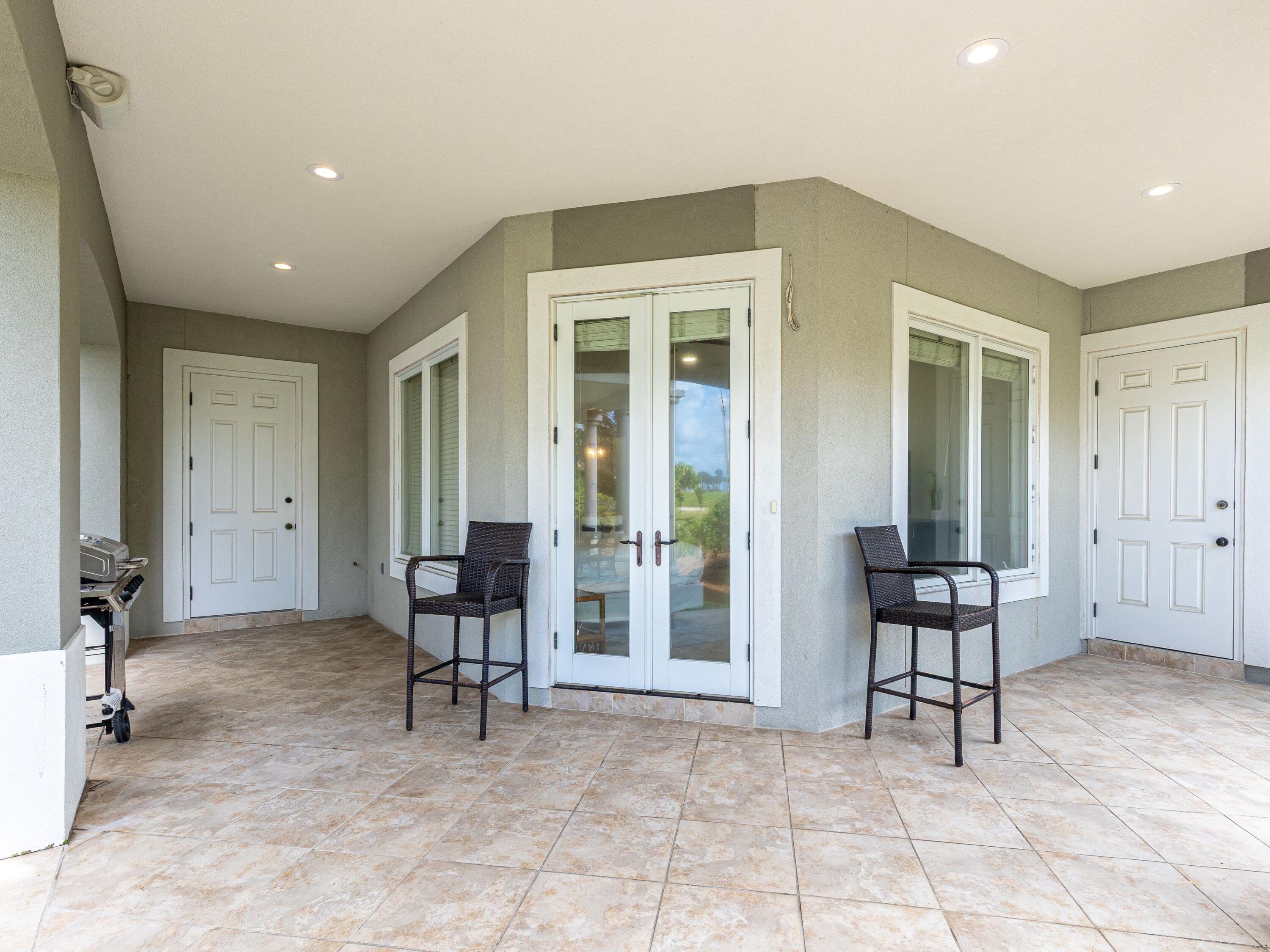 52 Tranquility Lane Destin, FL 32541 - Photo 24 of 65 a view of a big room with lounge chair and windows