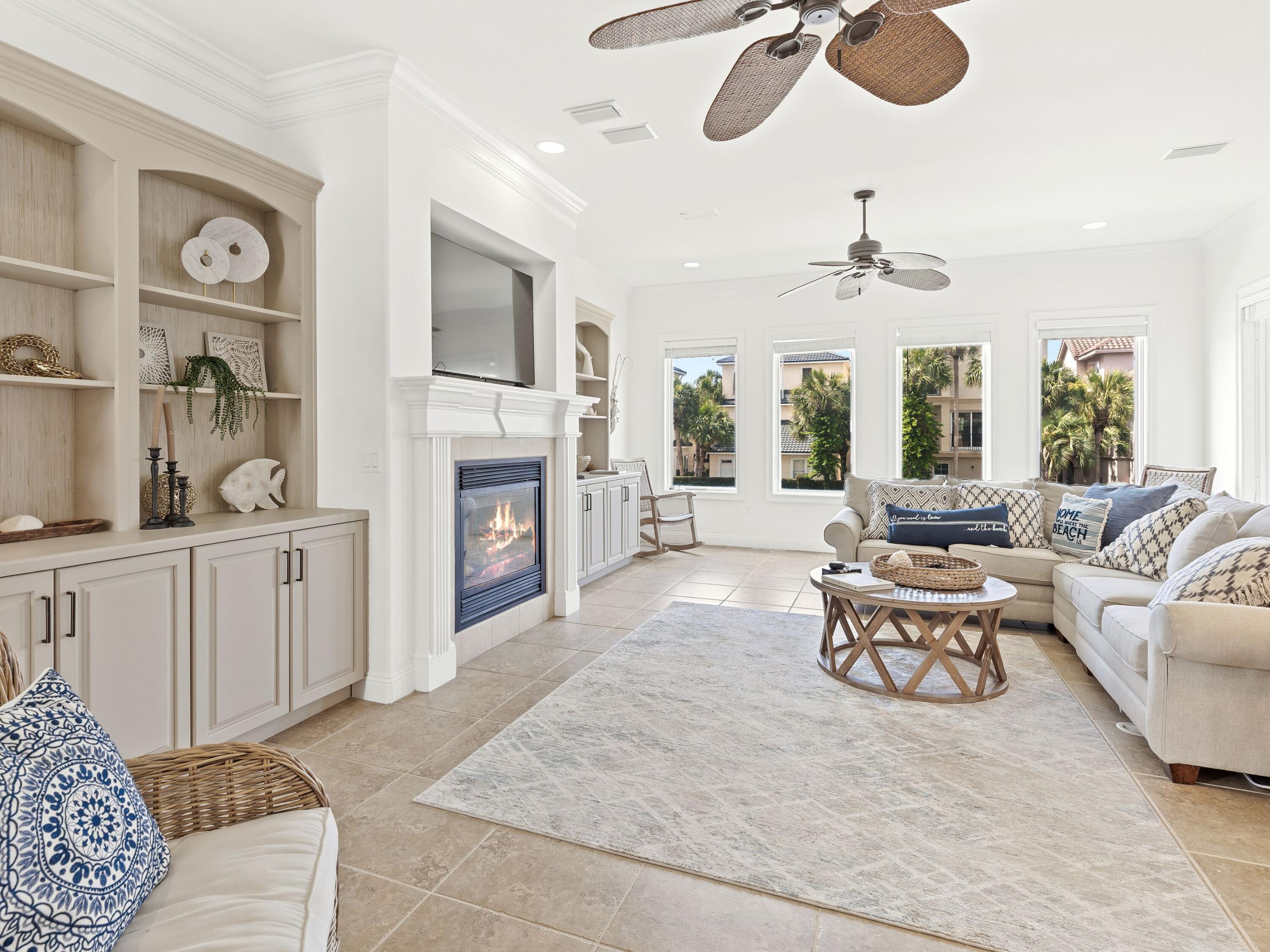 52 Tranquility Lane Destin, FL 32541 - Photo 28 of 65 a living room with furniture fireplace and flat screen tv