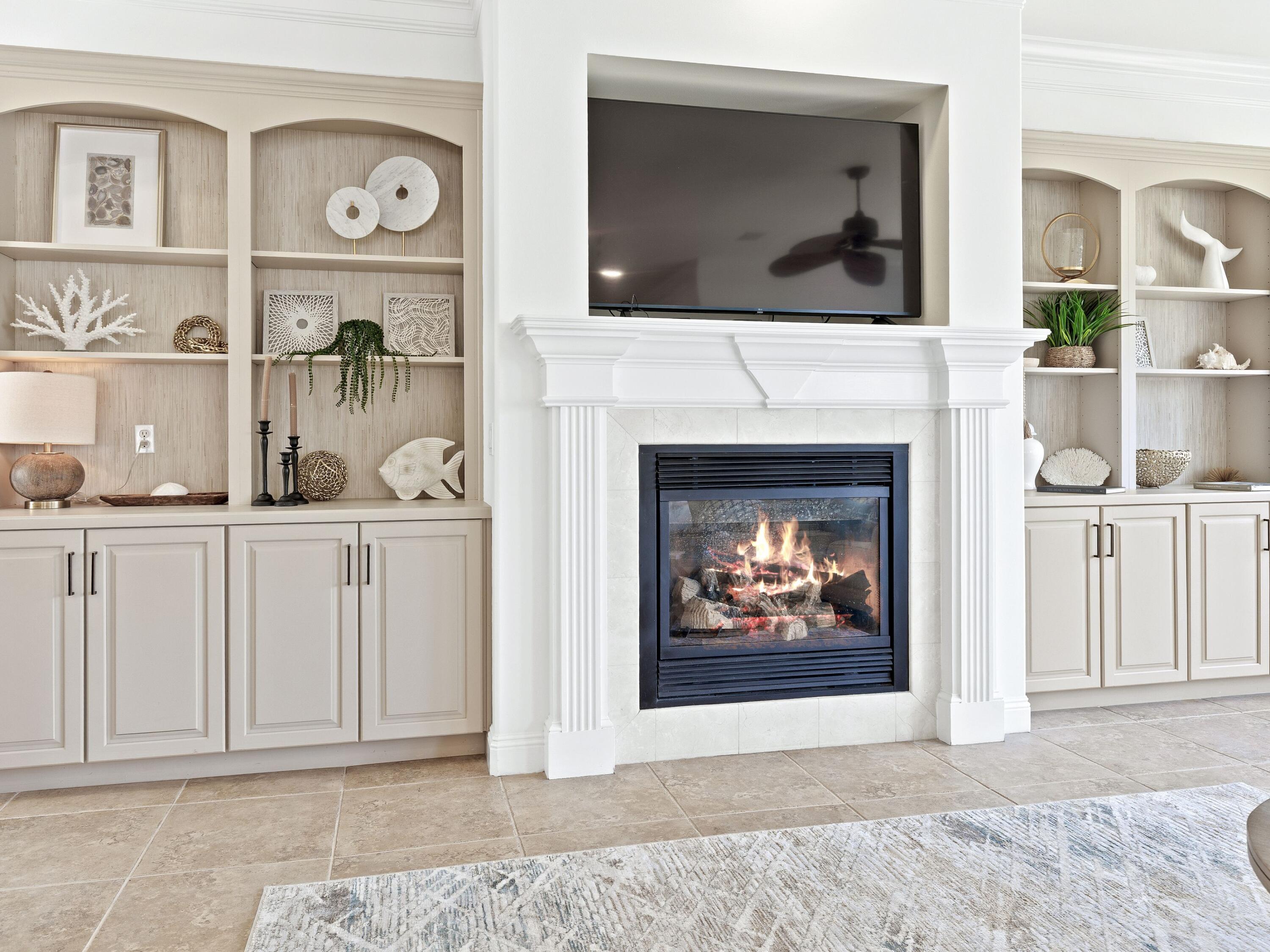 52 Tranquility Lane Destin, FL 32541 - Photo 29 of 65 a living room with furniture a fireplace and a flat screen tv