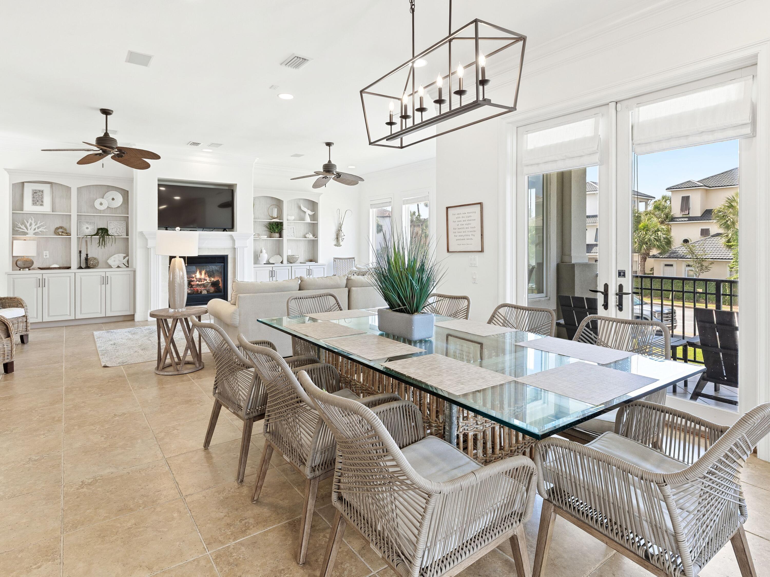 52 Tranquility Lane Destin, FL 32541 - Photo 31 of 65 a view of a dining room with furniture wooden floor and chandelier