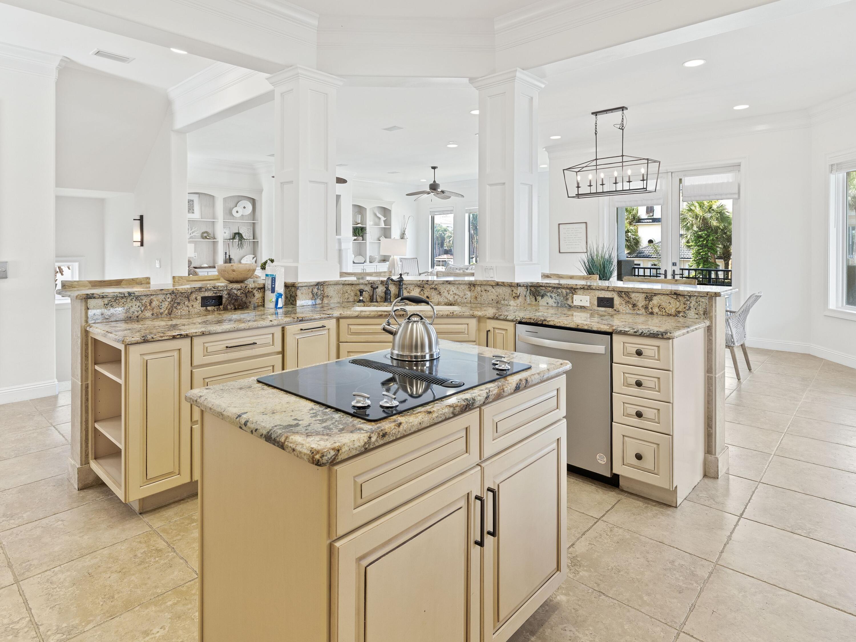 52 Tranquility Lane Destin, FL 32541 - Photo 35 of 65 a kitchen with stainless steel appliances granite countertop a sink and cabinets