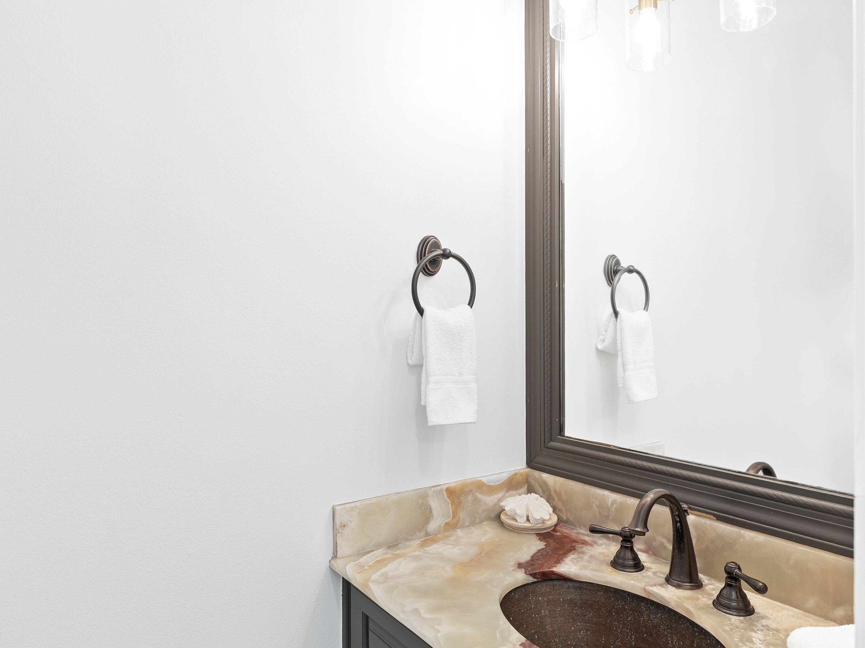 52 Tranquility Lane Destin, FL 32541 - Photo 36 of 65 a bathroom with a sink and mirror