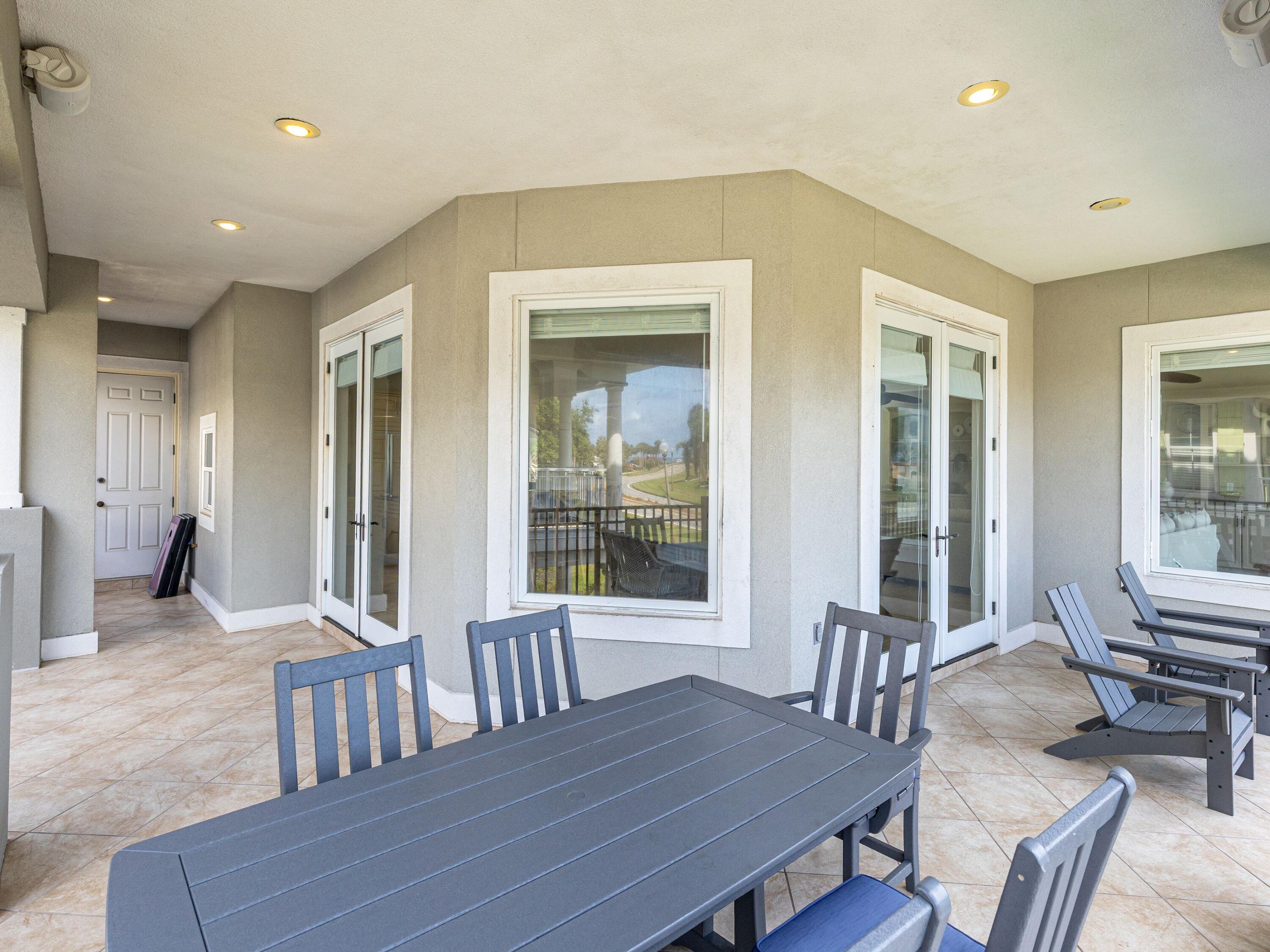 52 Tranquility Lane Destin, FL 32541 - Photo 39 of 65 a view of a dining room with furniture and windows