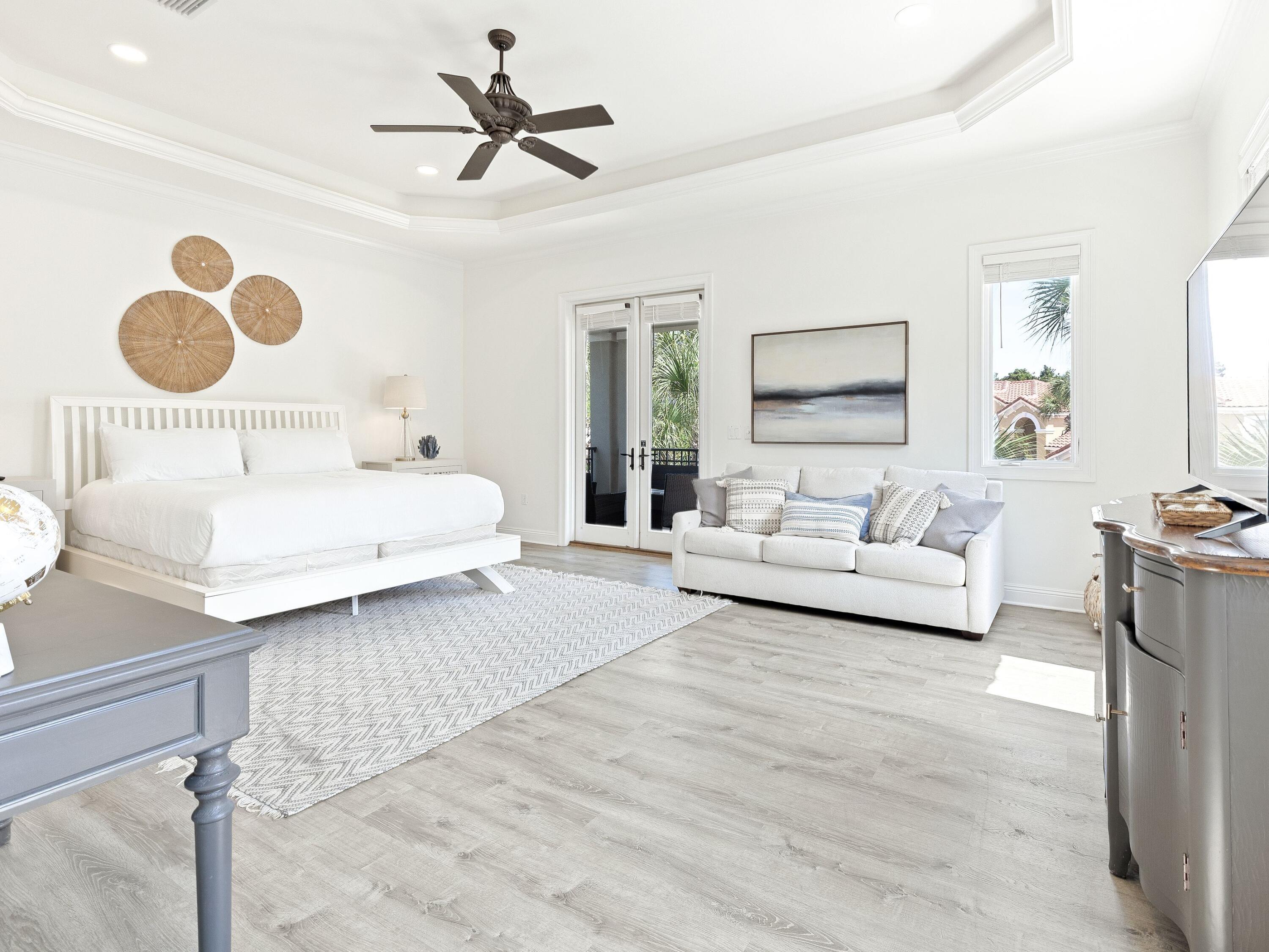52 Tranquility Lane Destin, FL 32541 - Photo 42 of 65 a bedroom with a large bed mirror and a window