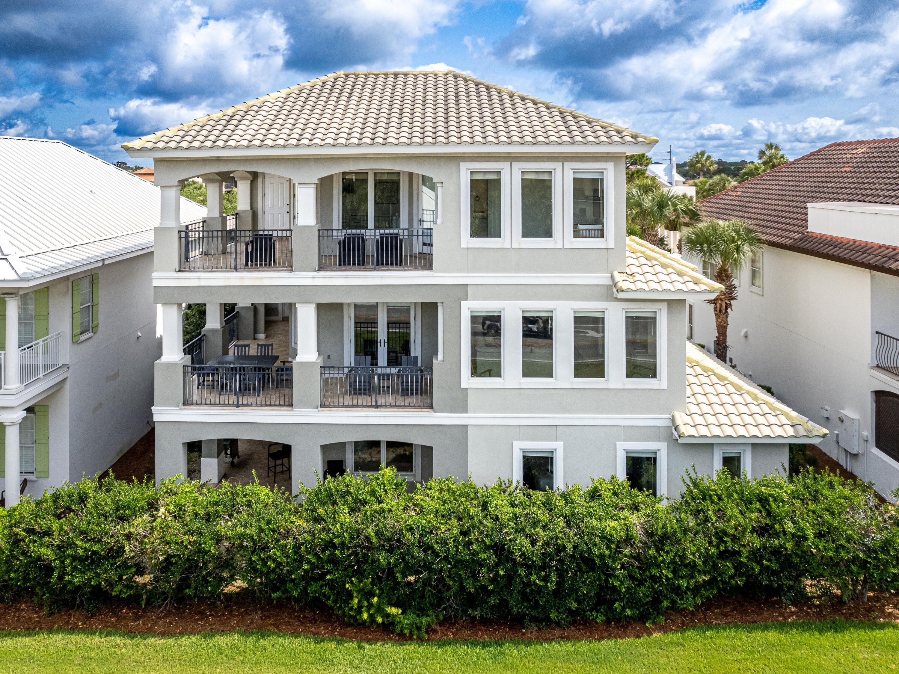 52 Tranquility Lane Destin, FL 32541 - Photo 5 of 65 a front view of a house with a yard
