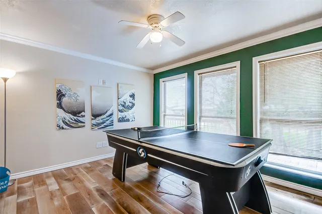 a view of a workspace with furniture and window