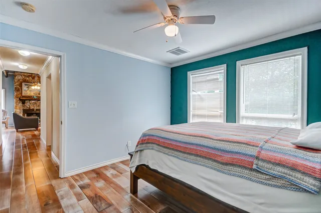 a bedroom with bed and a window