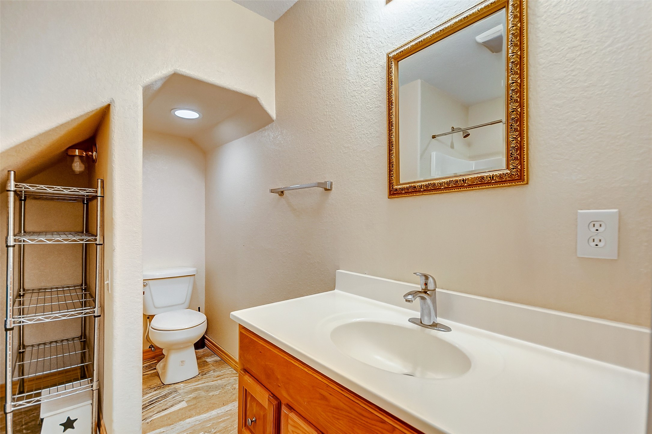 2101 7th Street High Island, TX 77650 - Photo 18 of 33 a bathroom with a toilet sink and mirror
