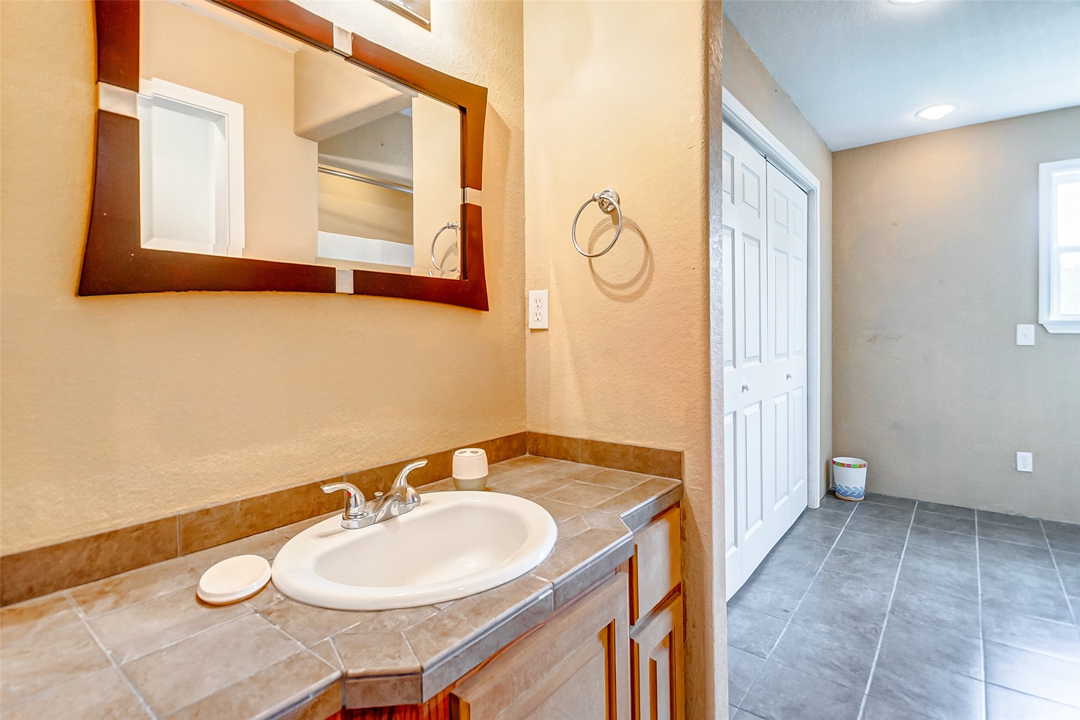 2101 7th Street High Island, TX 77650 - Photo 22 of 33 a bathroom with a sink and a mirror