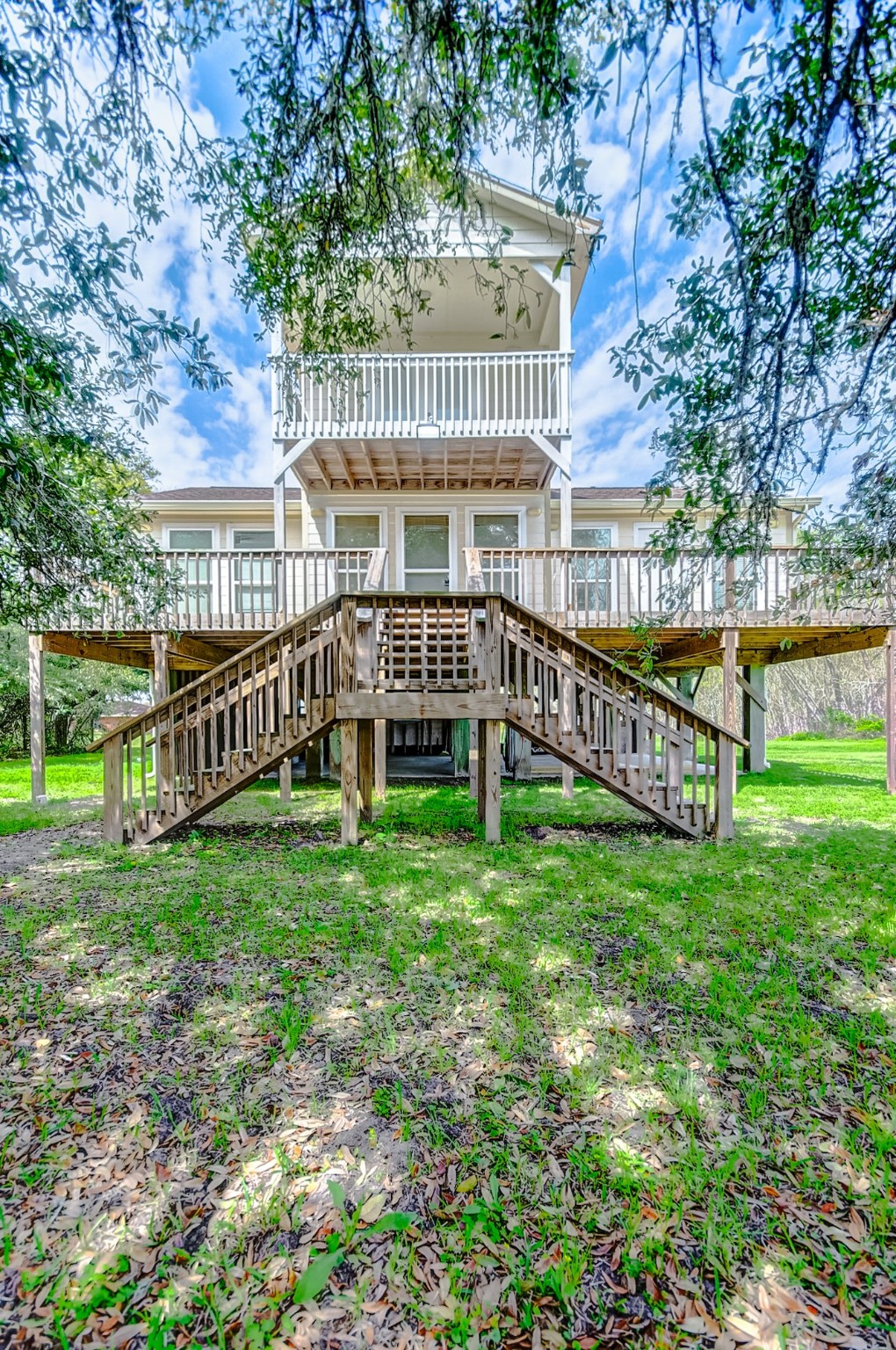 2101 7th Street High Island, TX 77650 - Photo 3 of 33 a view of a house with a backyard and a wooden deck