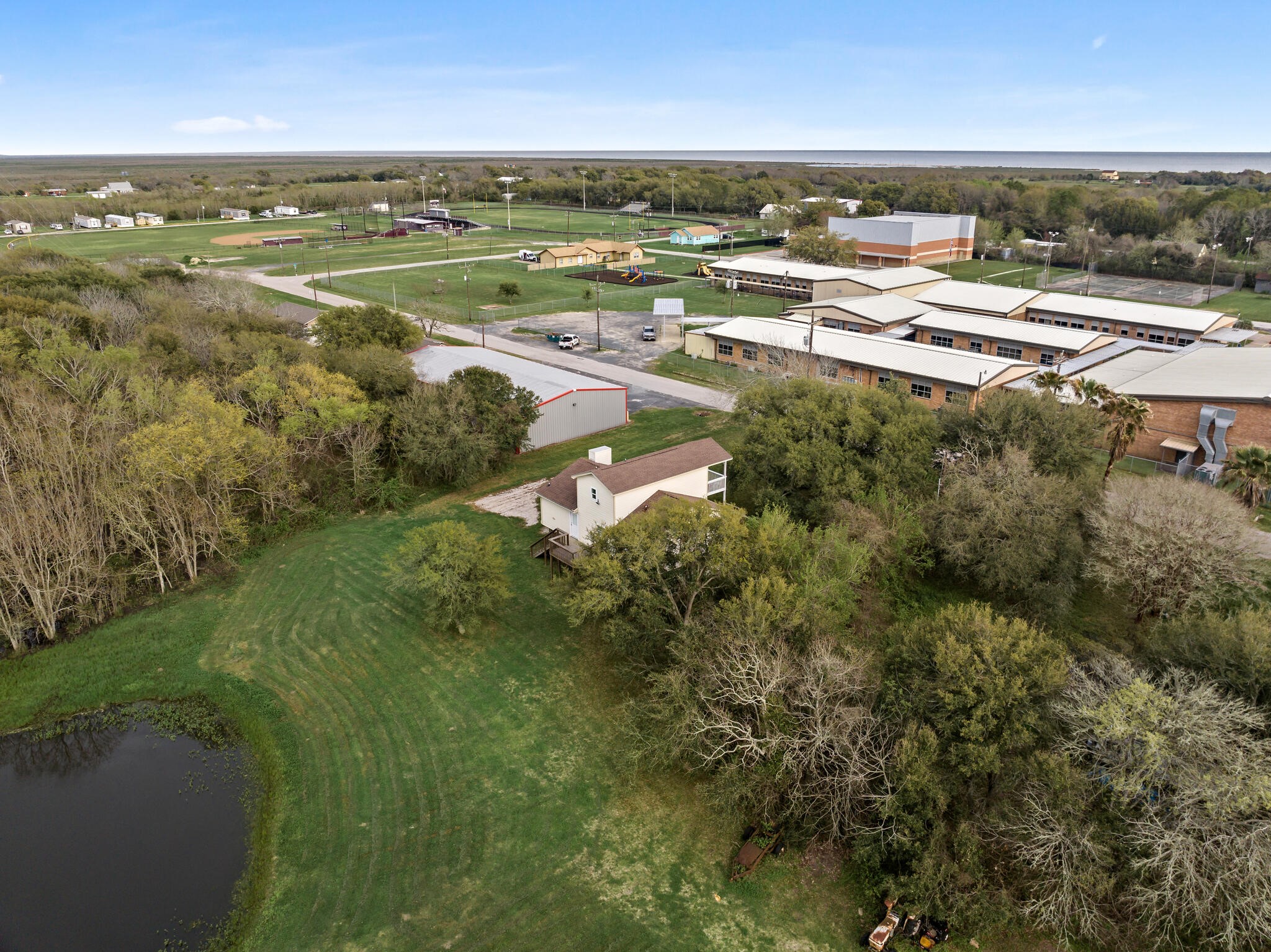 2101 7th Street High Island, TX 77650 - Photo 32 of 33 an aerial view of residential building and lake view