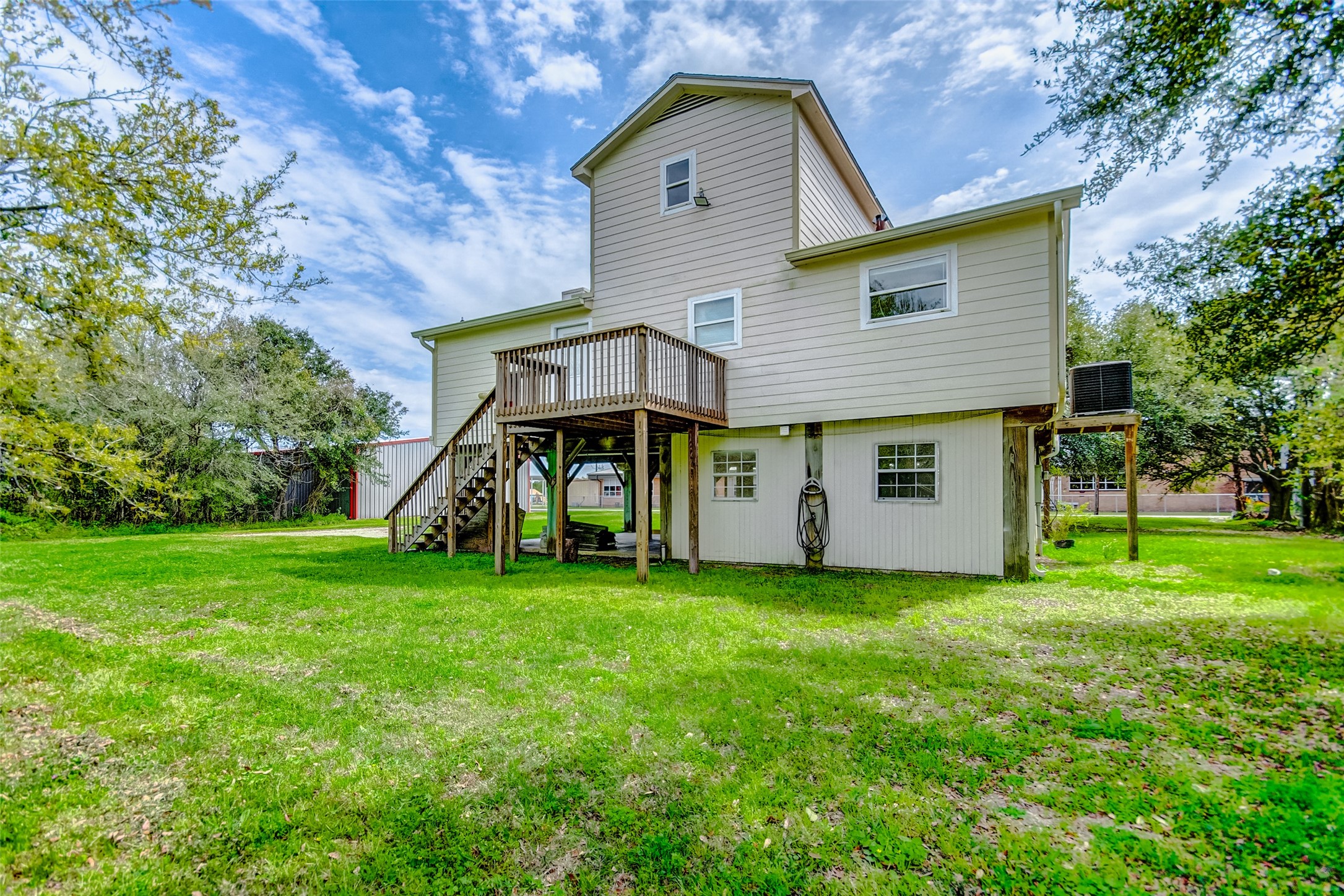 2101 7th Street High Island, TX 77650 - Photo 4 of 33 a view of a house with a yard