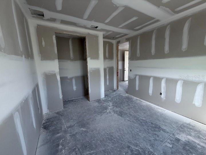 30141 Misty Pnes Road Mount Dora, FL 32757 - Photo 17 of 34 a view of a hallway with wooden shelves