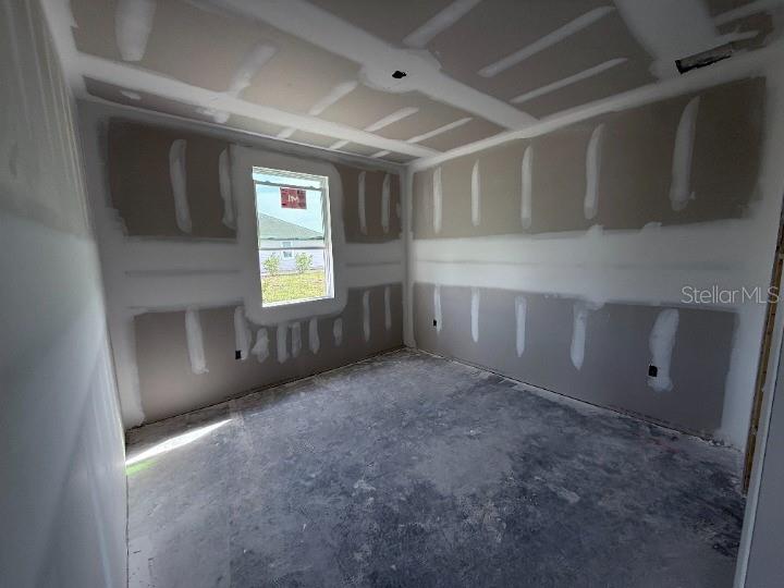 30141 Misty Pnes Road Mount Dora, FL 32757 - Photo 18 of 34 a view of an empty room with a window