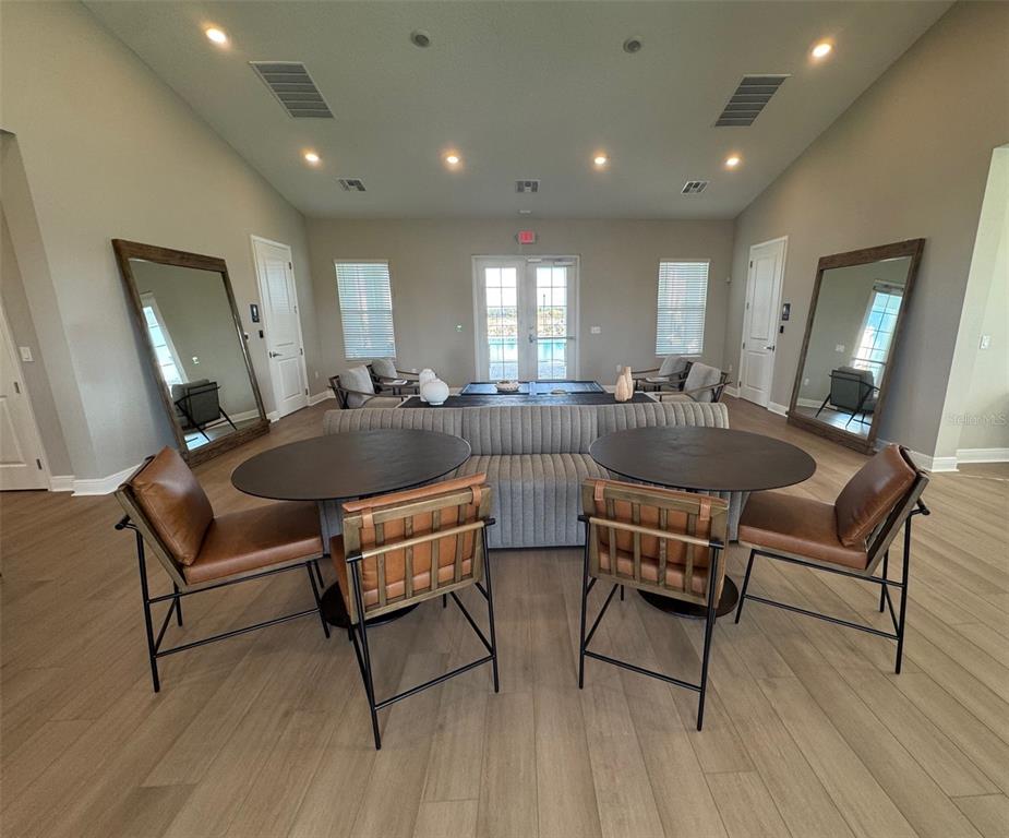 30141 Misty Pnes Road Mount Dora, FL 32757 - Photo 30 of 34 a living room with furniture and a wooden floor