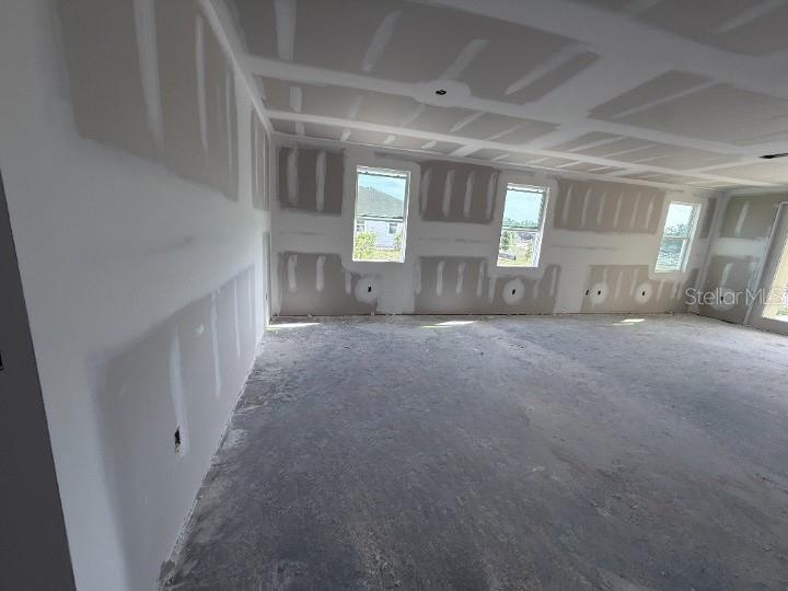 30141 Misty Pnes Road Mount Dora, FL 32757 - Photo 4 of 34 a view of a hallway with a livingroom and a window