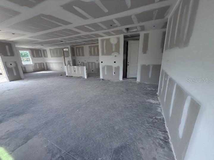 30141 Misty Pnes Road Mount Dora, FL 32757 - Photo 7 of 34 a view of empty room with wooden floor