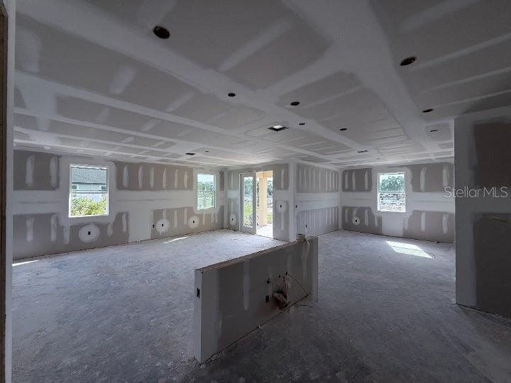 30141 Misty Pnes Road Mount Dora, FL 32757 - Photo 10 of 34 a view of an empty room with window and fireplace
