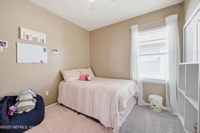 a room with a bed and a chandelier