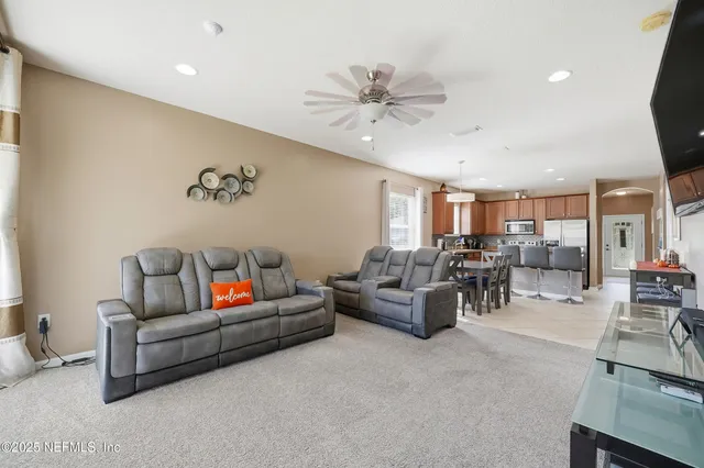 a living room with furniture and white walls