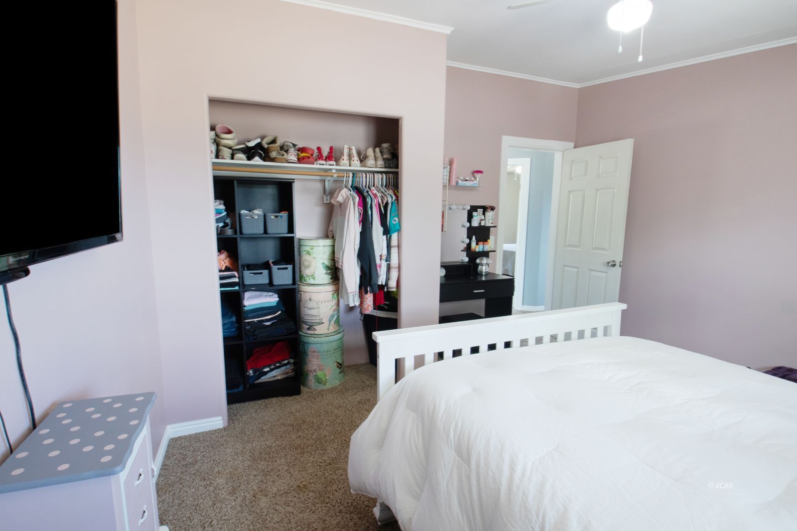 591 Spring Valley Parkway Spring Creek, NV 89815 - Photo 19 of 25 a bedroom with a bed and a mirror