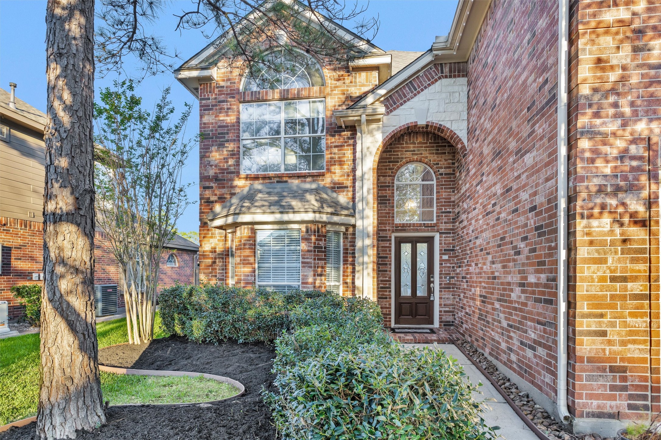 30110 Legends Ridge Drive Spring, TX 77386 - Photo 10 of 49 front view of a brick house with a large windows