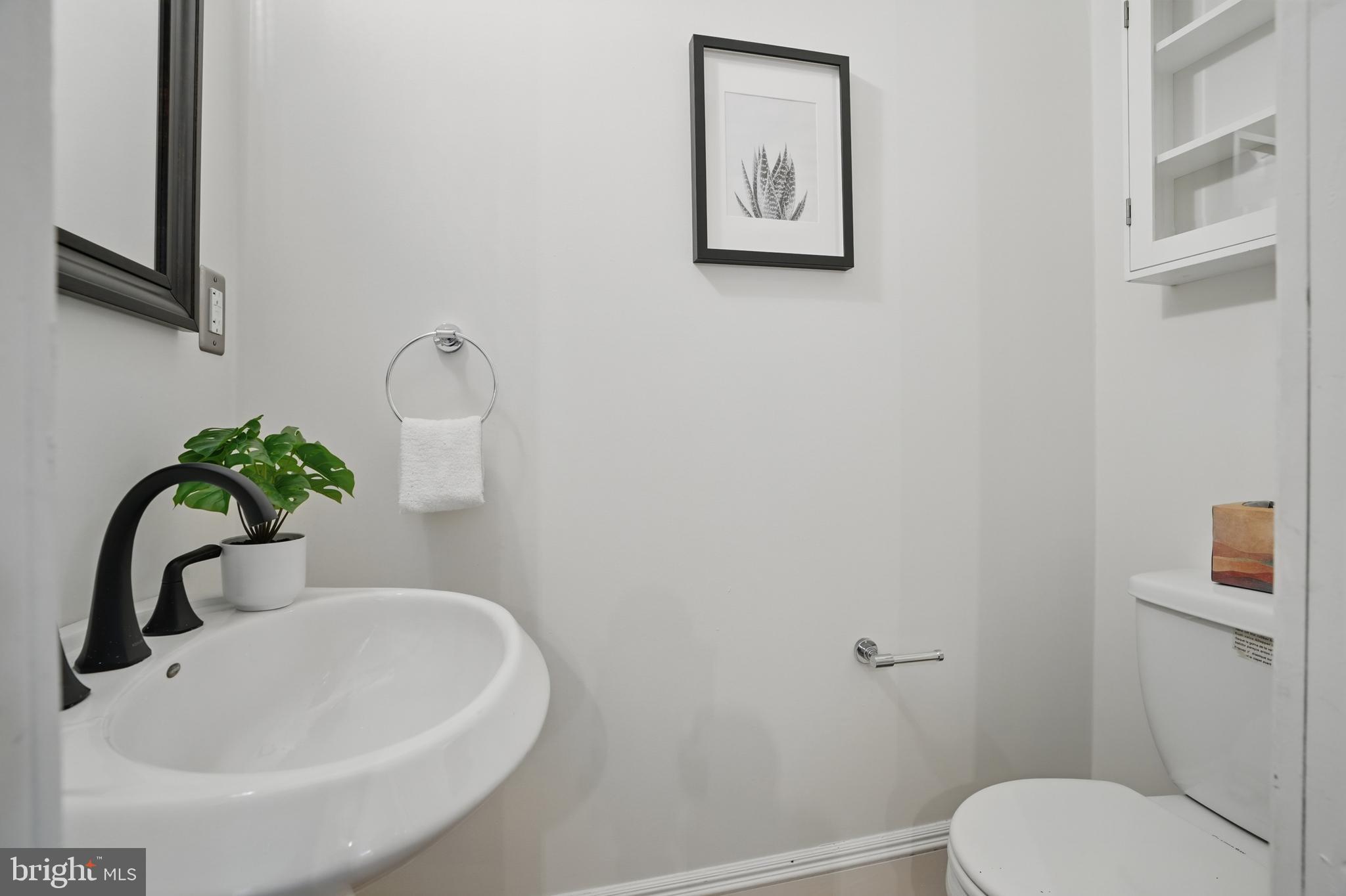 136 R Street Northeast Washington, DC 20002 - Photo 17 of 36 a bathroom with a sink and a toilet