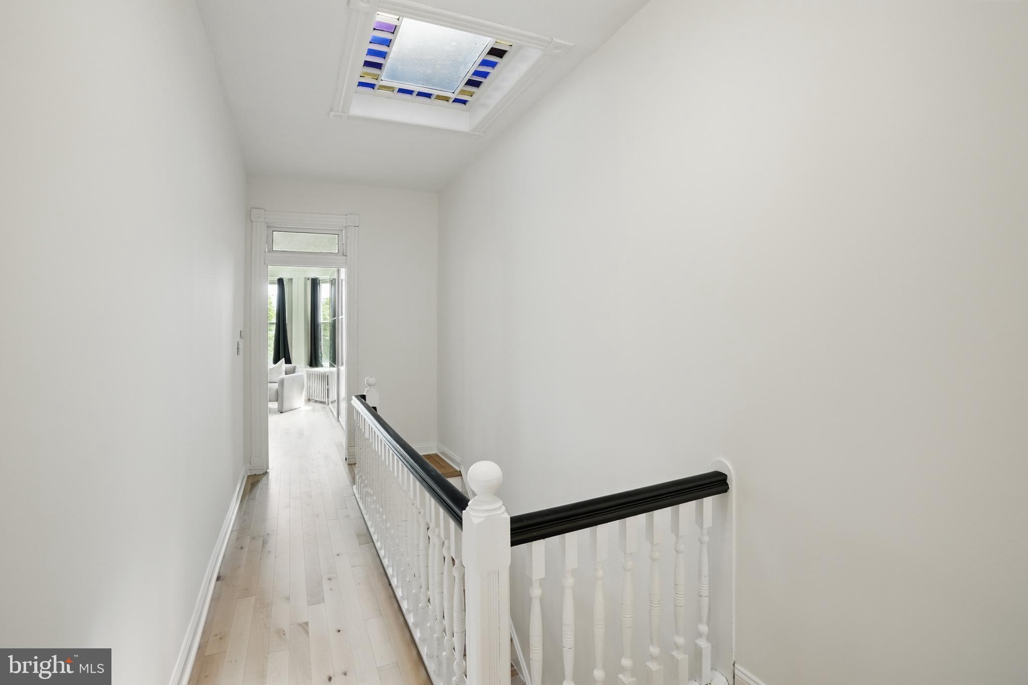 136 R Street Northeast Washington, DC 20002 - Photo 22 of 36 a view of a hallway with a white walls