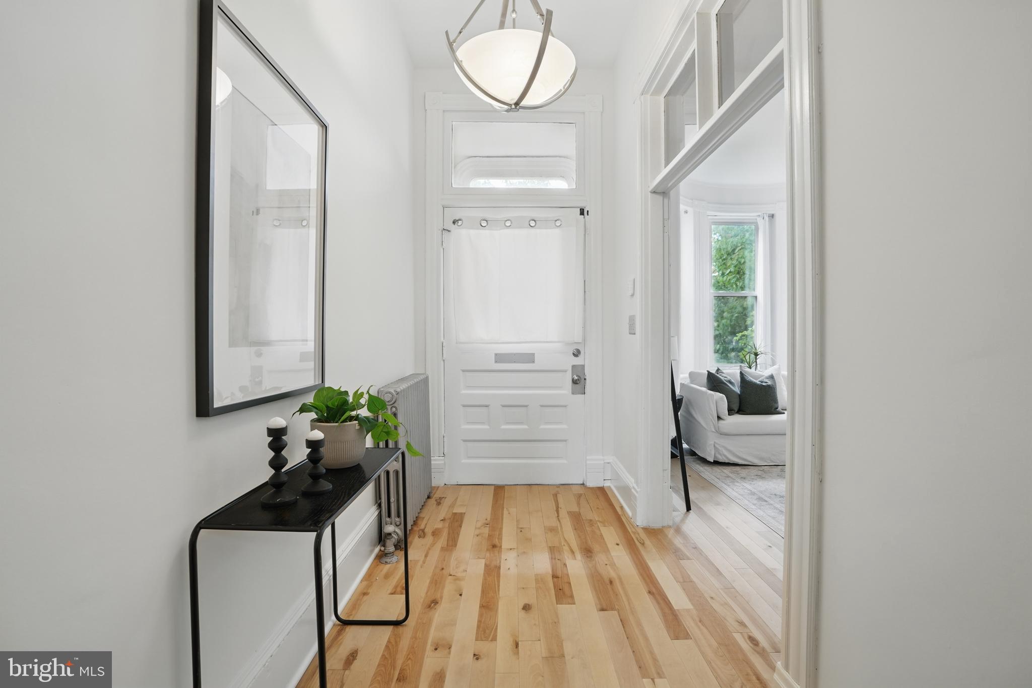 136 R Street Northeast Washington, DC 20002 - Photo 5 of 36 a view of a room with wooden floor and windows