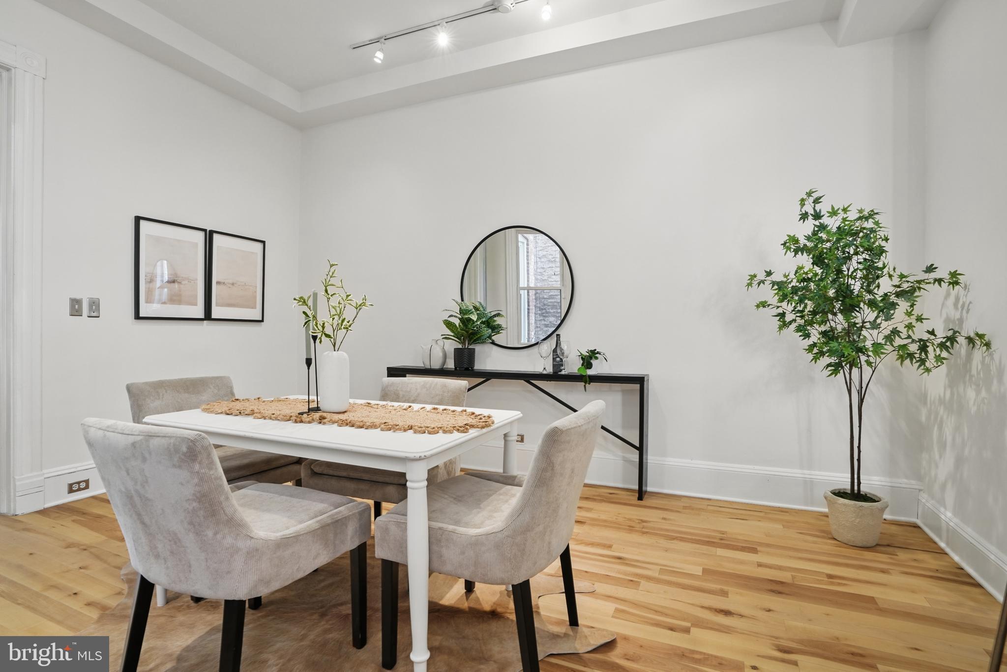 136 R Street Northeast Washington, DC 20002 - Photo 10 of 36 a view of a dining room with furniture and wooden floor