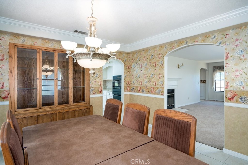 34150 Stowe Road Winchester, CA 92545 - Photo 24 of 80 a living room with furniture a chandelier and a large mirror