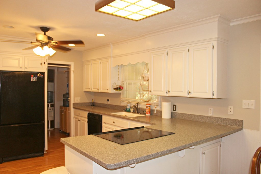 1892 Boxankle Road Forsyth, GA 31029 - Photo 2 of 20 a kitchen with stainless steel appliances granite countertop a sink a stove a refrigerator a washer dryer and white cabinets