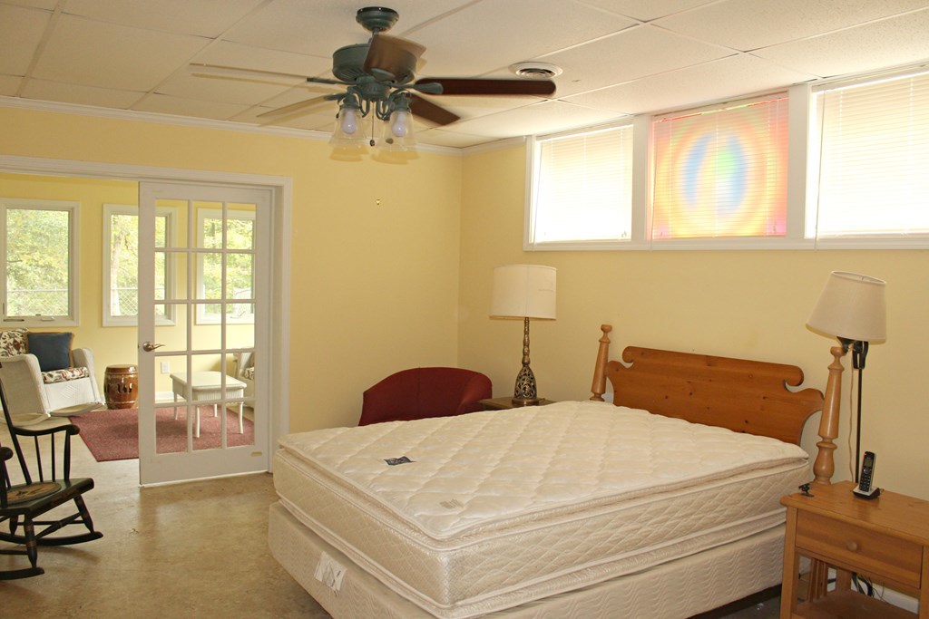1892 Boxankle Road Forsyth, GA 31029 - Photo 7 of 20 a bedroom with a bed and a chandelier