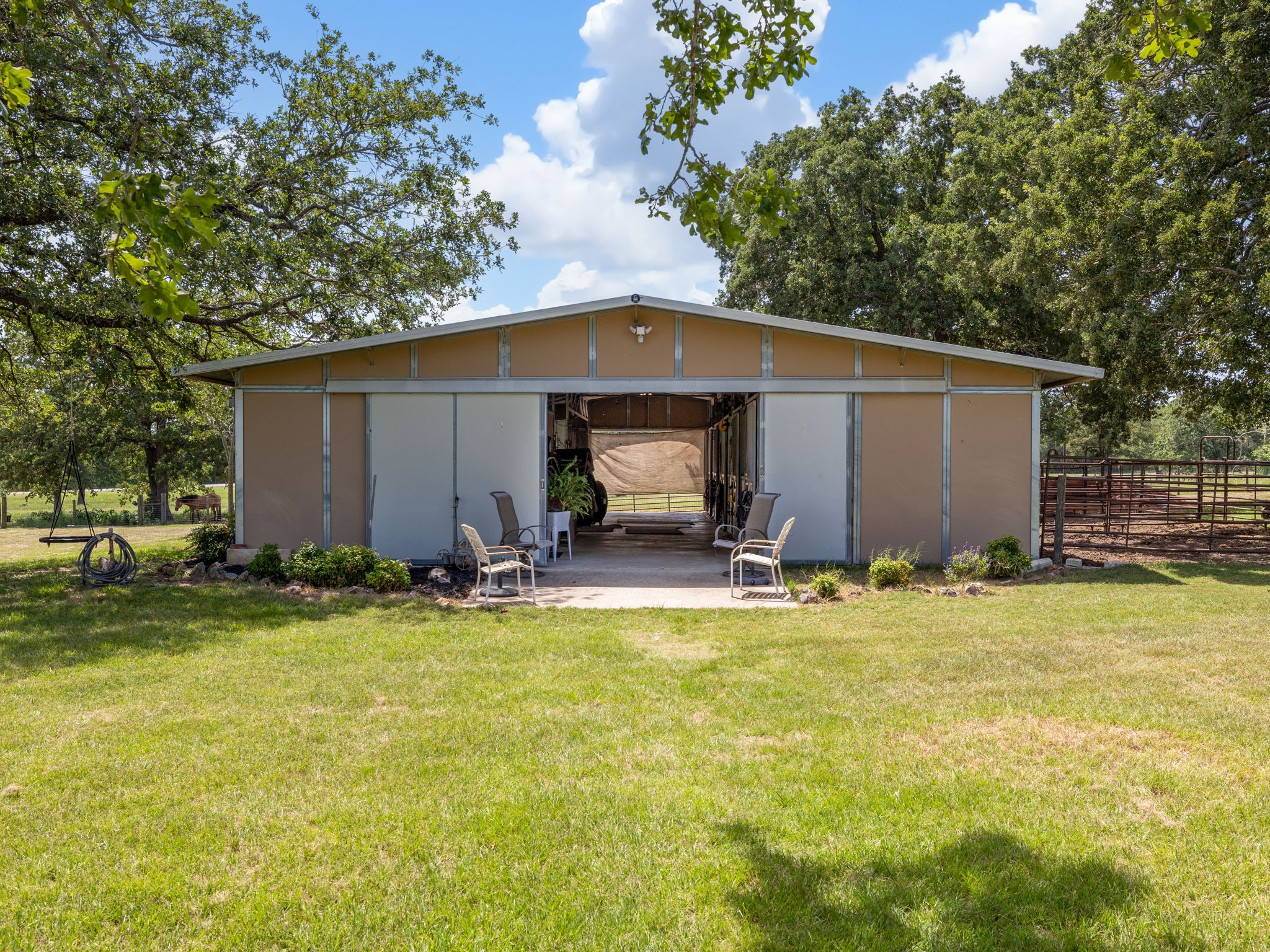 a view of a house with pool and a yard