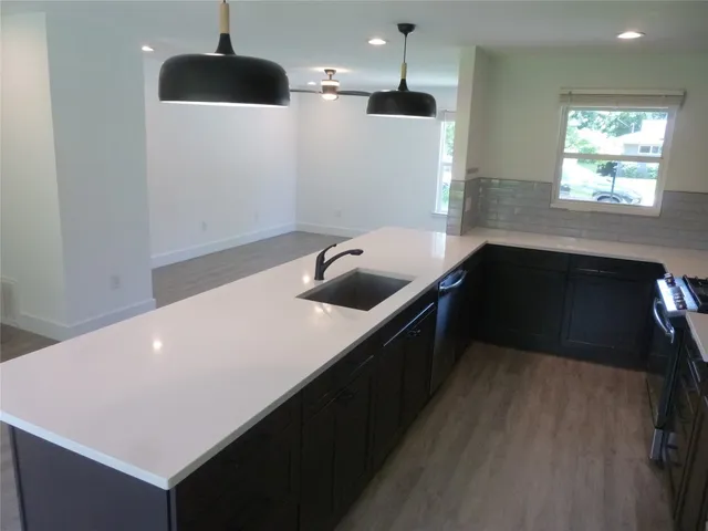 a kitchen with a table and chairs