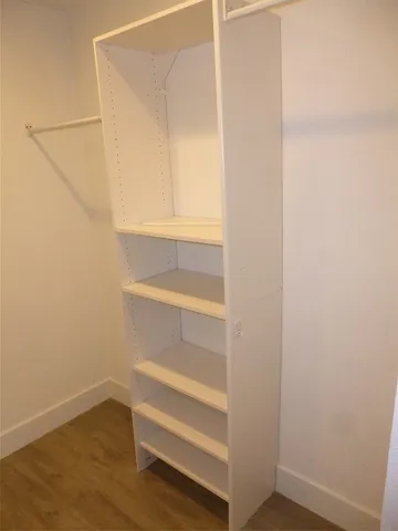 a view of an empty walk in closet