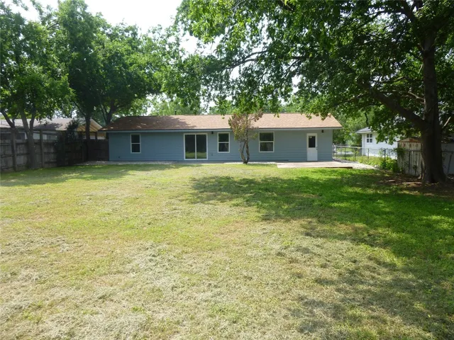 a house with a tree in front of it