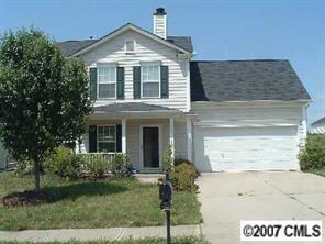 11516 Chapeclane Road Charlotte, NC 28278 - Photo 1 of 5 a front view of a house with a yard