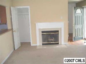 11516 Chapeclane Road Charlotte, NC 28278 - Photo 2 of 5 a view of a livingroom with a fireplace