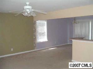 11516 Chapeclane Road Charlotte, NC 28278 - Photo 3 of 5 an empty room with a window