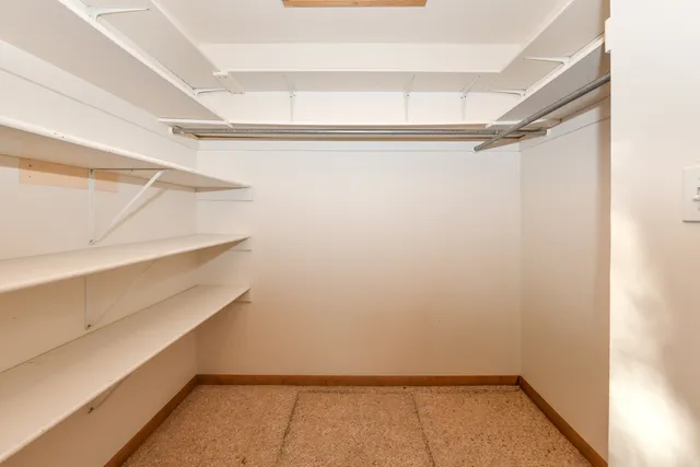 a view of an empty walk in closet