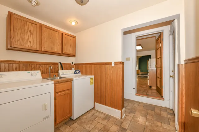 a view of a hallway with washer and dryer