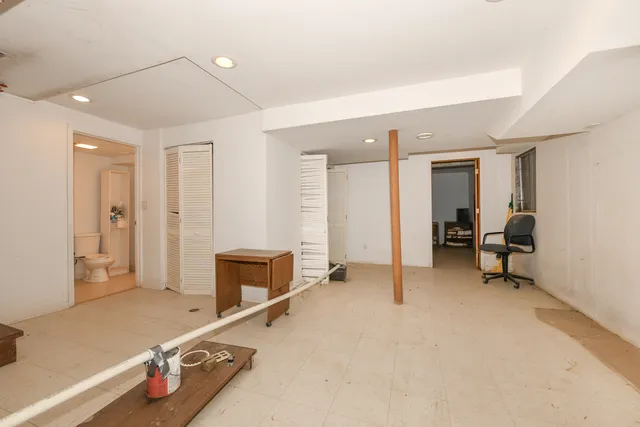 a room with a mirror and gym equipment