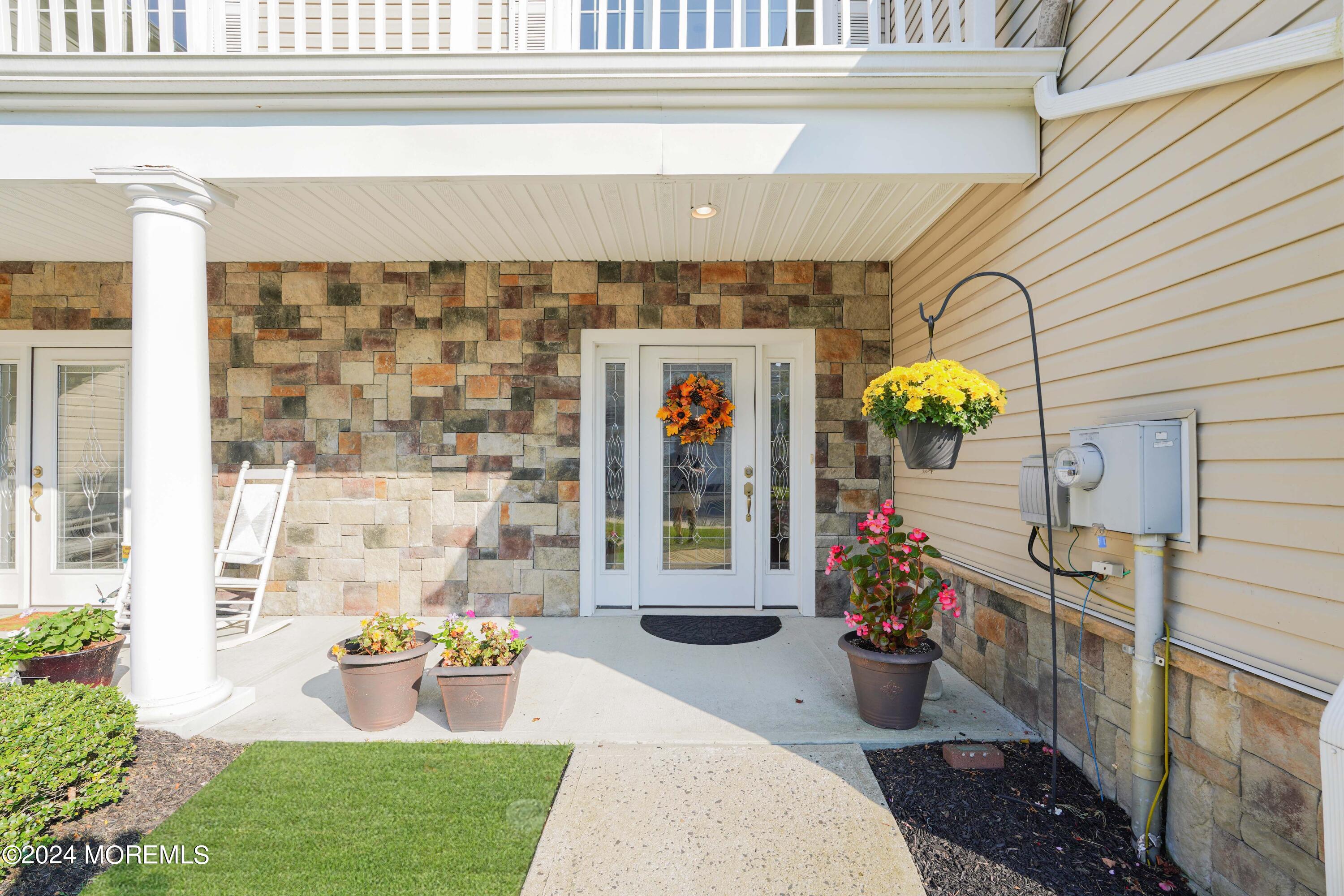 32 Abbey Road Tinton Falls, NJ 07753 - Photo 3 of 32 a front view of a house with outdoor seating