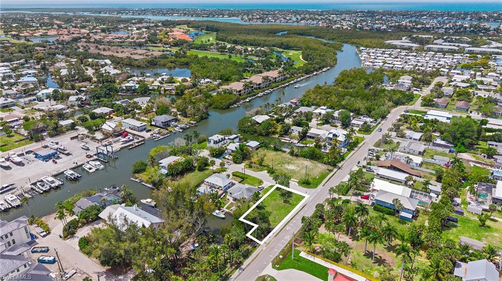 Orange Street Naples, FL 34112 - Photo 4 of 6 an aerial view of residential houses with outdoor space