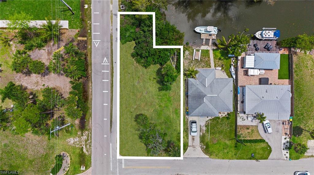 Orange Street Naples, FL 34112 - Photo 5 of 6 an aerial view of a house with a yard and fountain
