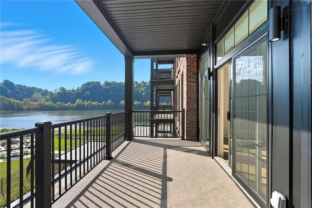 a view of a balcony with furniture