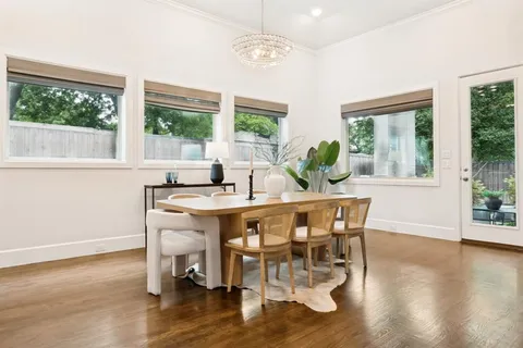 a dining room with furniture window wooden floor