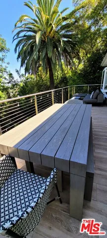 a view of a yard with wooden deck