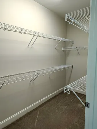 a view of a room with racks on the wall